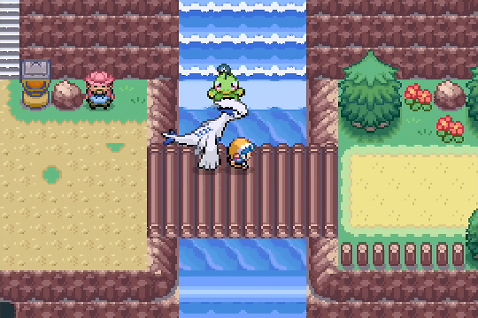 Player exploring a new Johto route with cliffs and waterfalls in Pokemon SoulGold